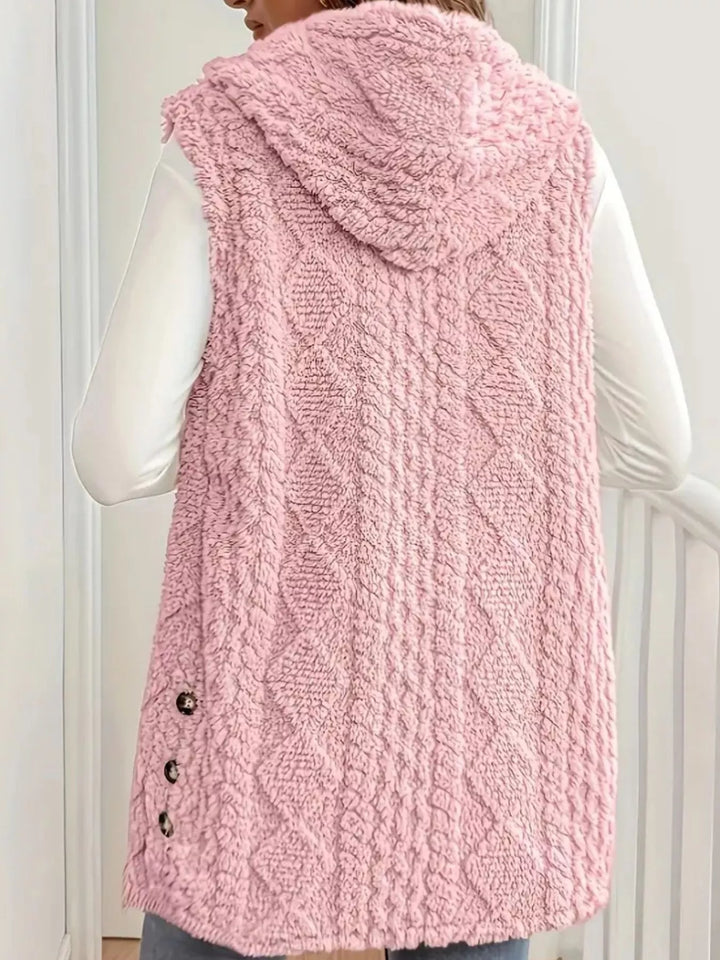Back view of the blush pink hooded vest with cable pattern