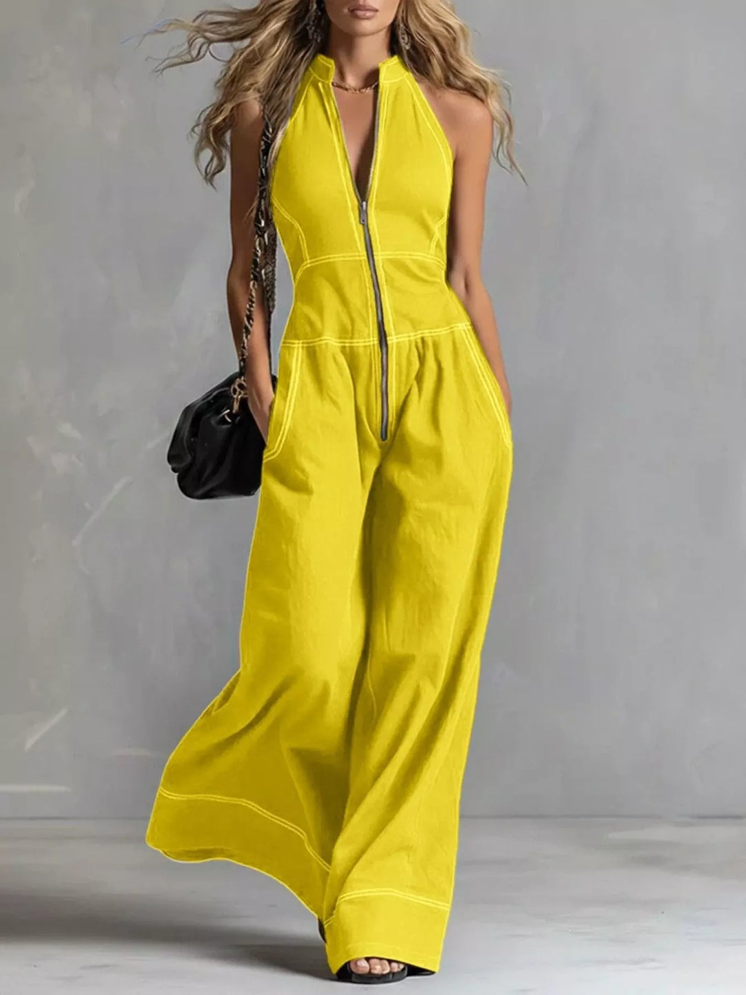 Yellow halter neck zip front jumpsuit with wide legs, full-length view
