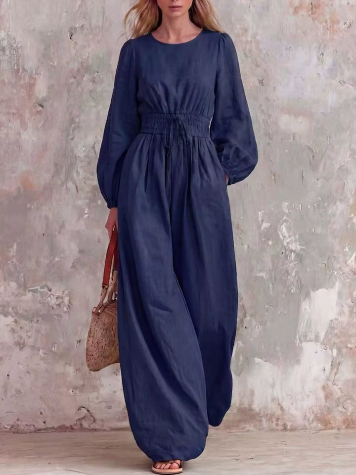 Women's navy long balloon sleeve jumpsuit with wide legs, full length front view