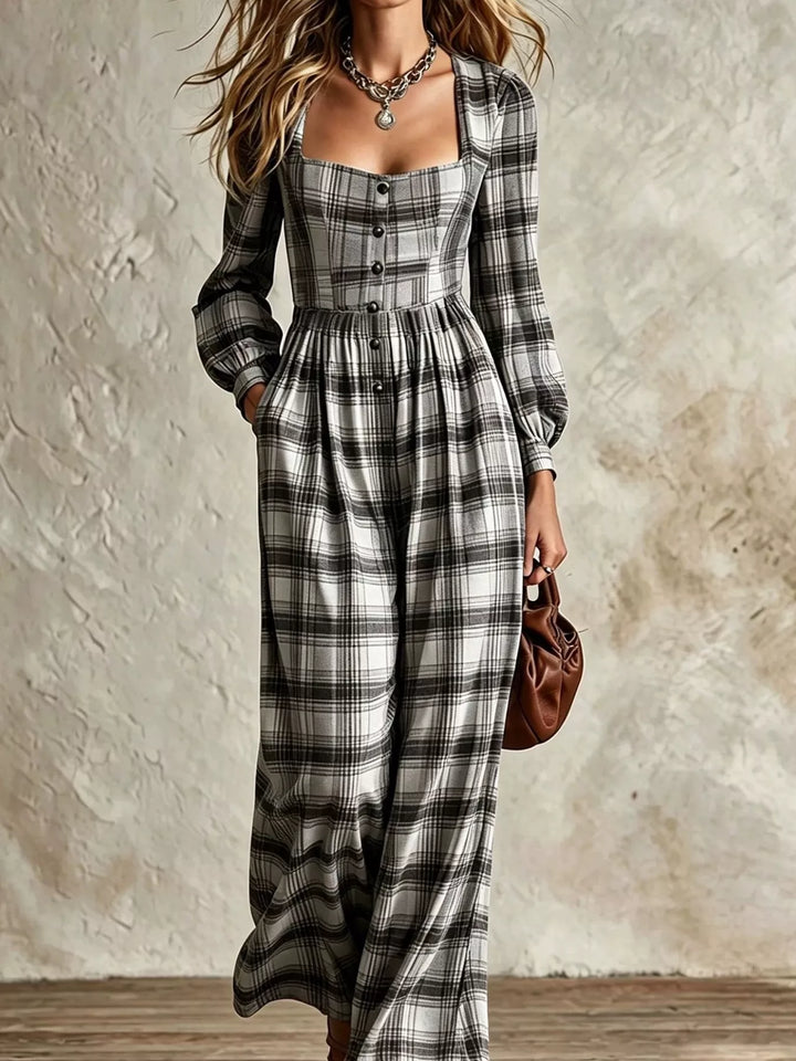black and white plaid long sleeve jumpsuit with button bodice, styled with a brown bag