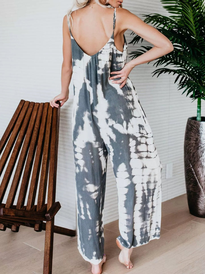 Back view of the gray tie dye jumpsuit with a low scoop back