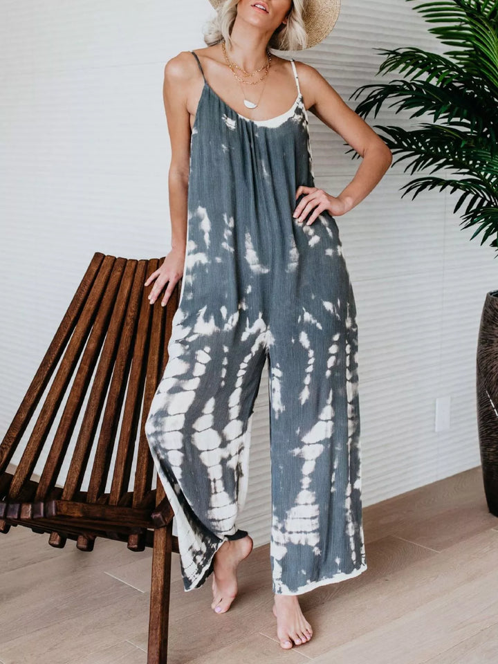 Gray tie dye sleeveless jumpsuit, front view standing barefoot