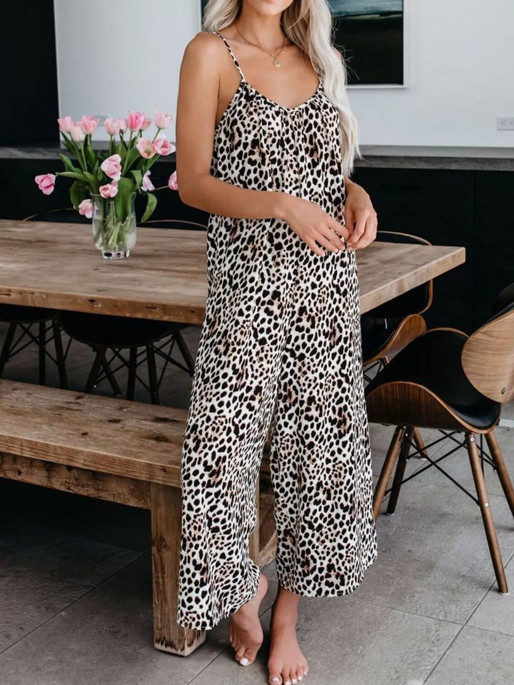 Leopard print wide leg jumpsuit in a relaxed three-quarter pose