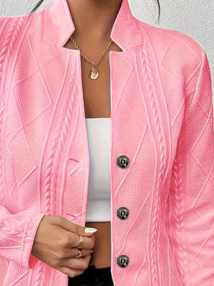 Close-up of the pink blazer stand collar and textured knit