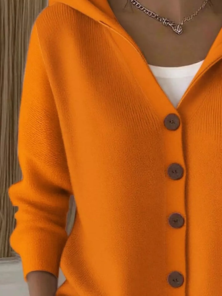 Close-up of the orange cardigan hood and V neckline
