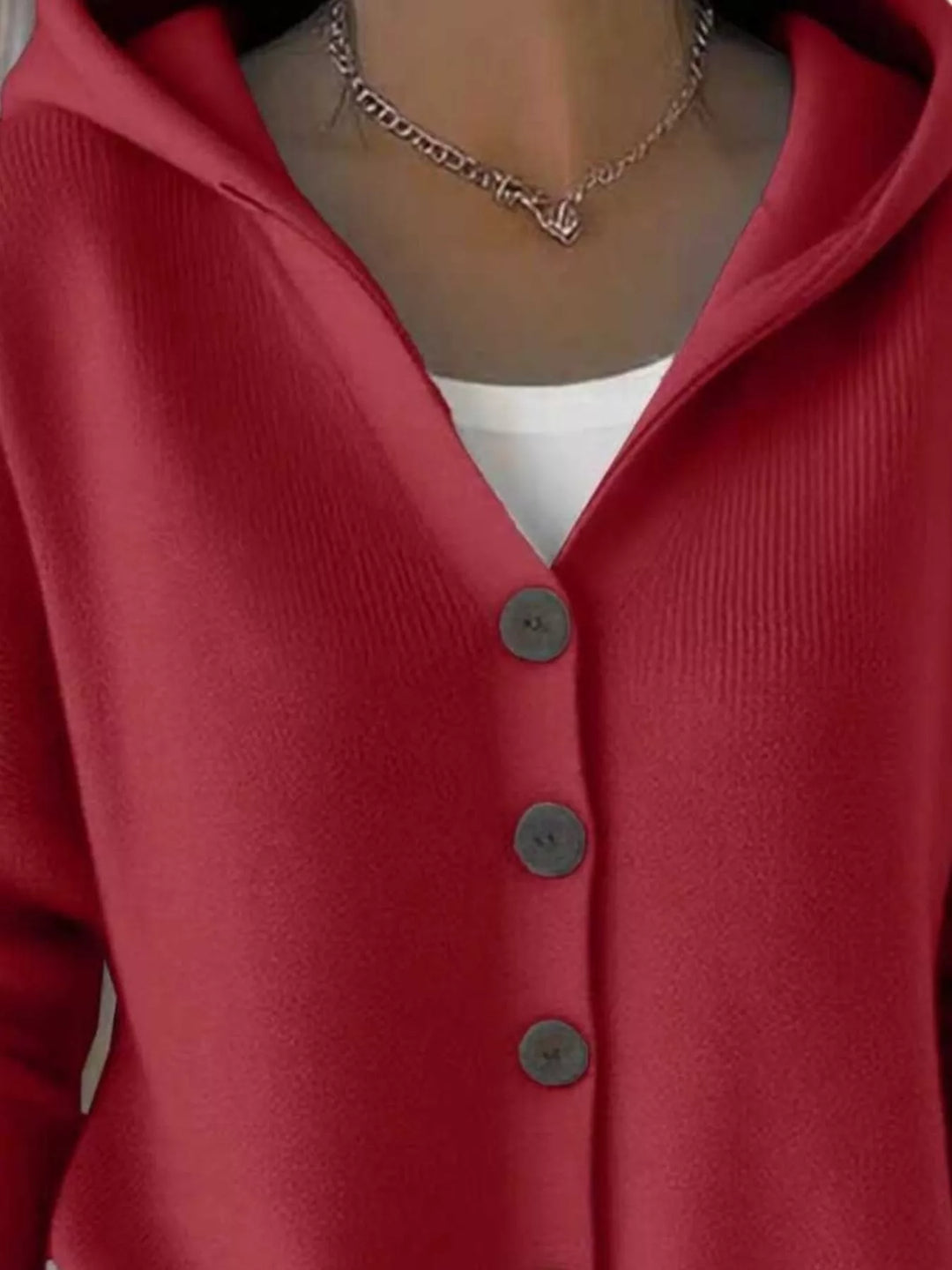 Close-up of the red cardigan hood and V neckline