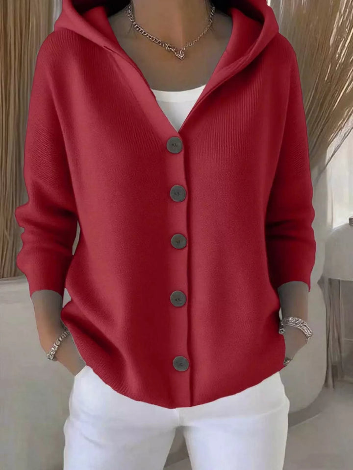 Red hooded knit cardigan with wooden-look buttons, front view
