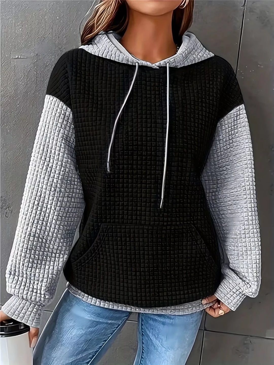 Waffle texture kangaroo pocket drawstring hood in black/white, front view
