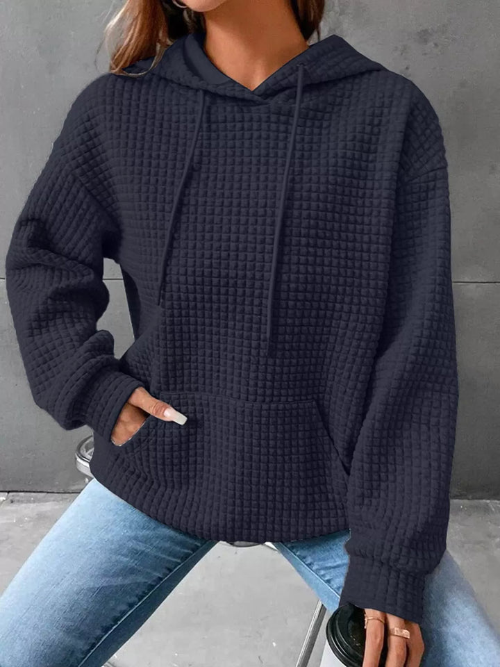 Waffle texture kangaroo pocket drawstring hood in navy, styled on model