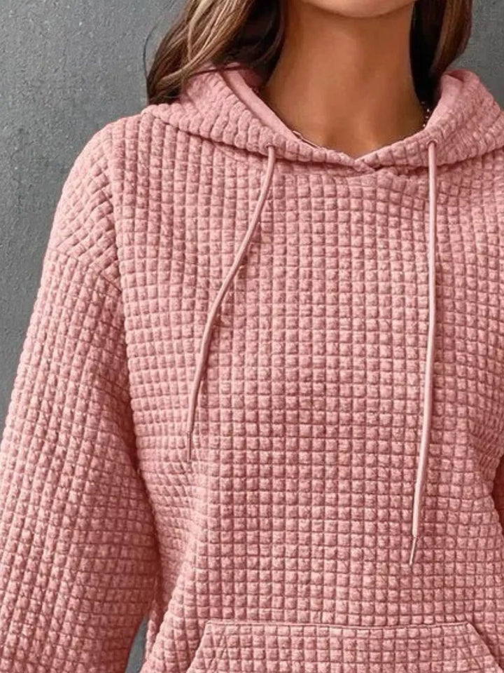Waffle texture kangaroo pocket drawstring hood in pink, close-up detail