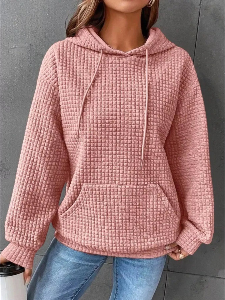 Waffle texture kangaroo pocket drawstring hood in pink, styled on model