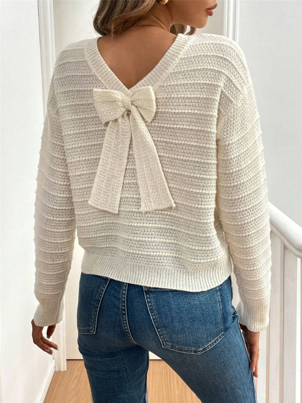 Bow detail open v back textured in beige, back view 2