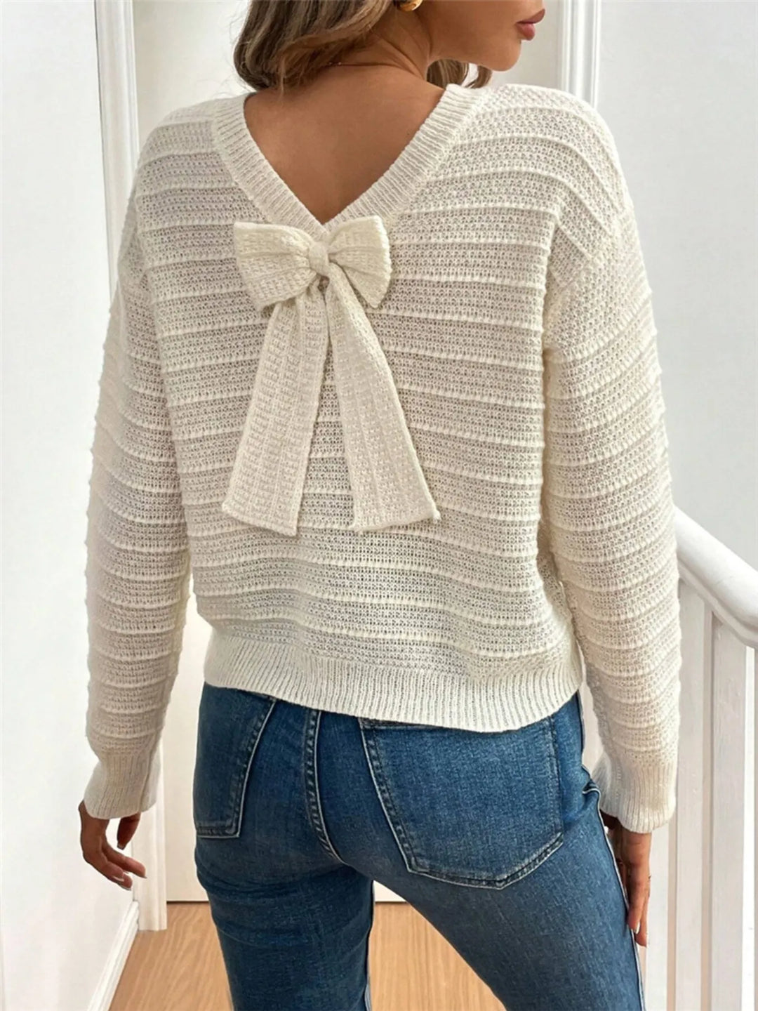 Bow detail open v back textured in beige, back view 2