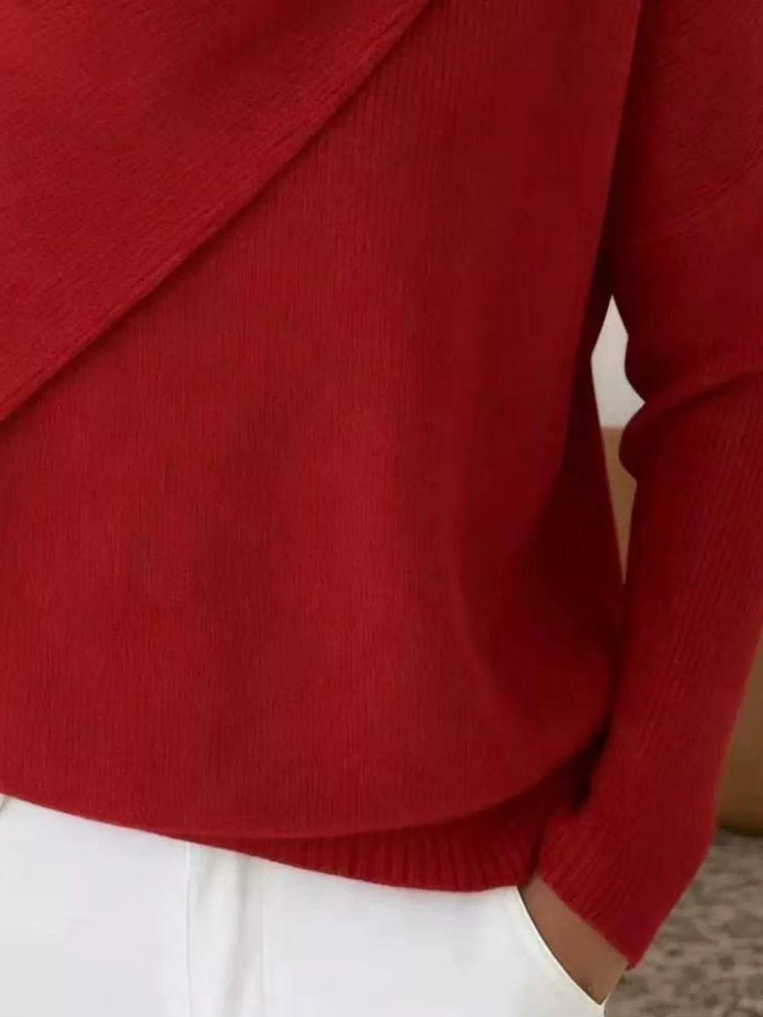 Draped diagonal cowl neck ribbed hem in red, close-up detail 2