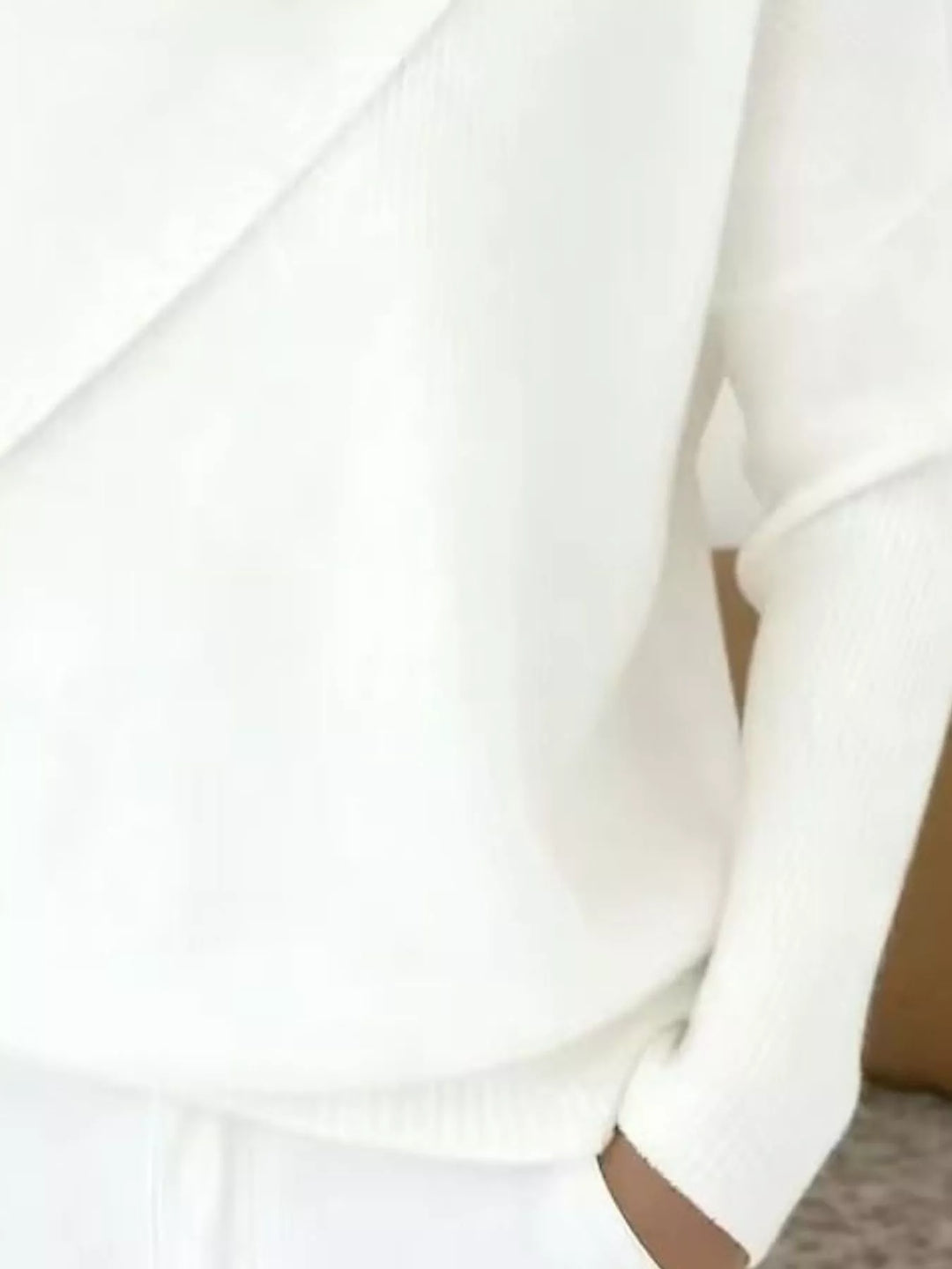 Draped diagonal cowl neck ribbed hem in white, close-up detail 2