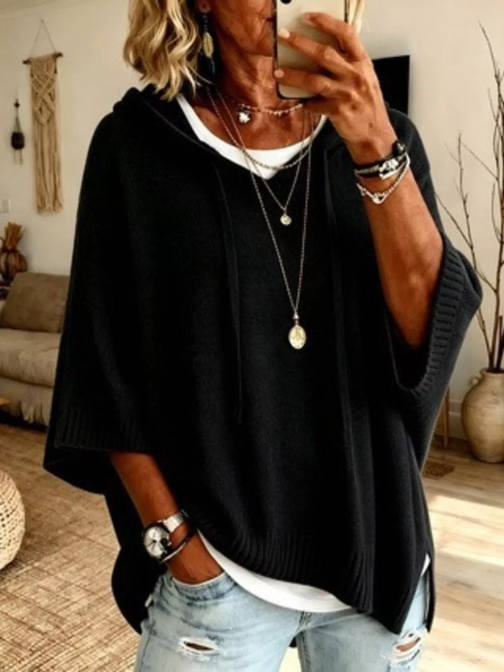 Hooded batwing elbow-length sleeves in black, front view