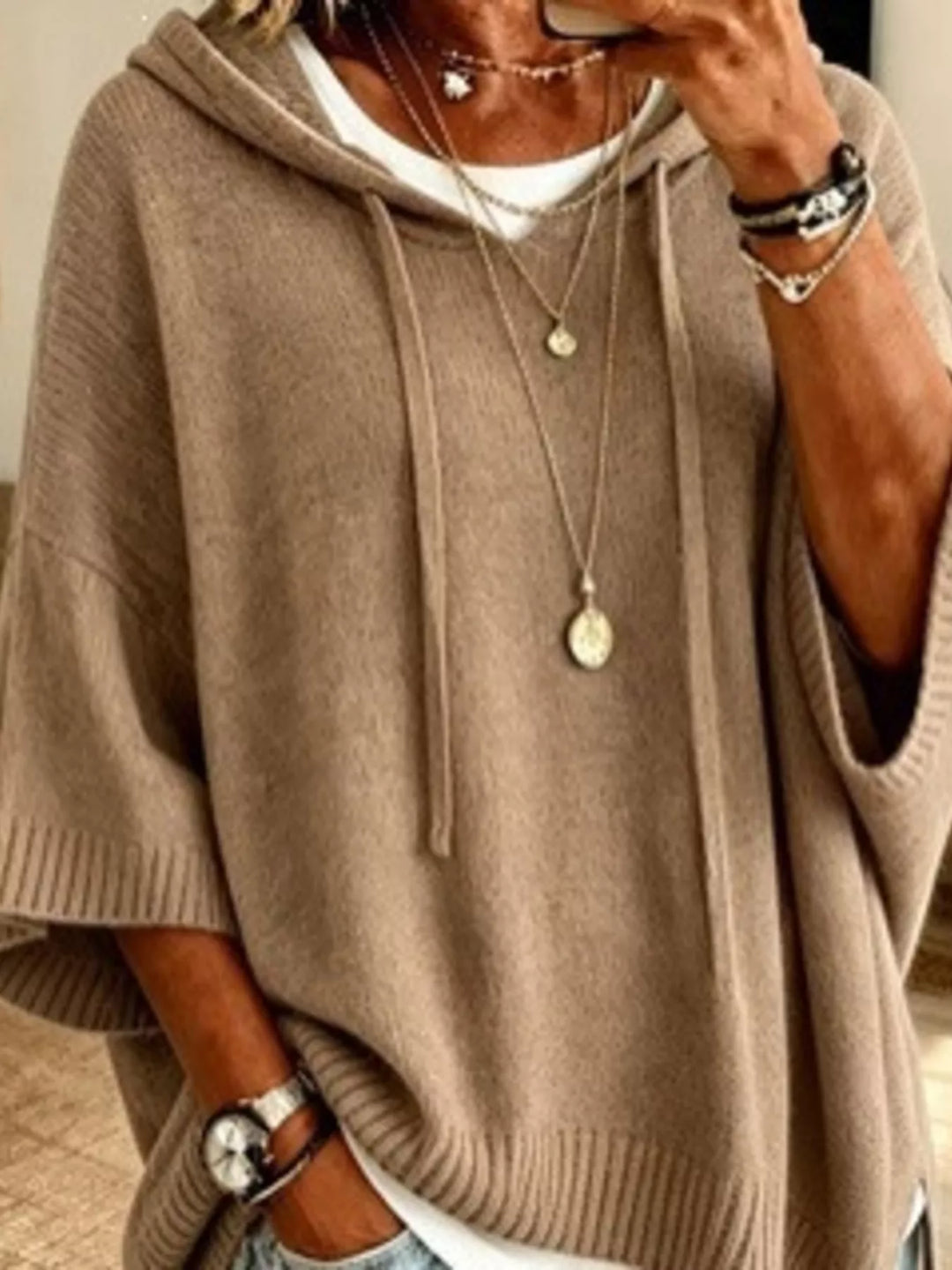 Hooded batwing elbow-length sleeves in khaki, close-up detail