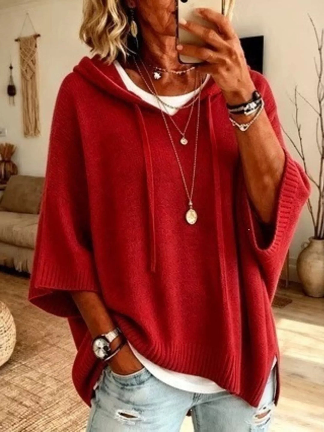 Red hooded knit sweater with drawstrings and batwing sleeves, front view