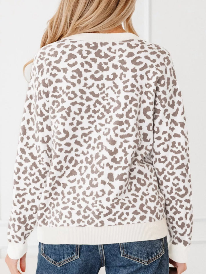 Back view of the ivory leopard print cardigan with ribbed hem