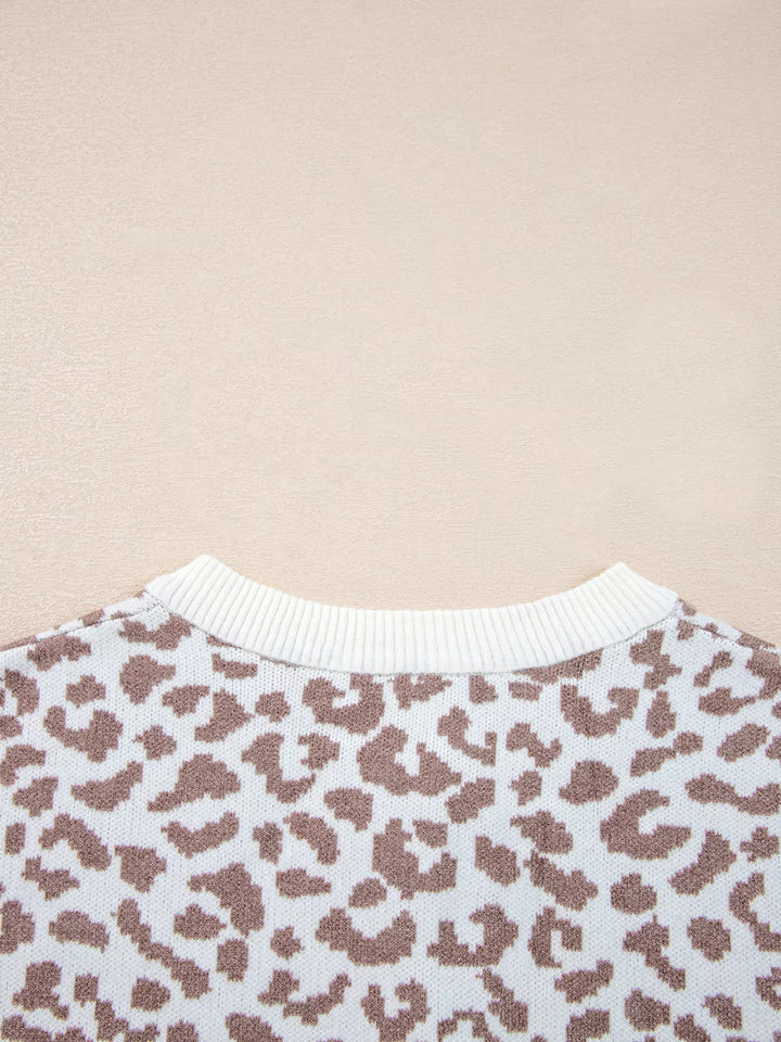 Close-up of the round neck ribbed trim on the ivory leopard cardigan