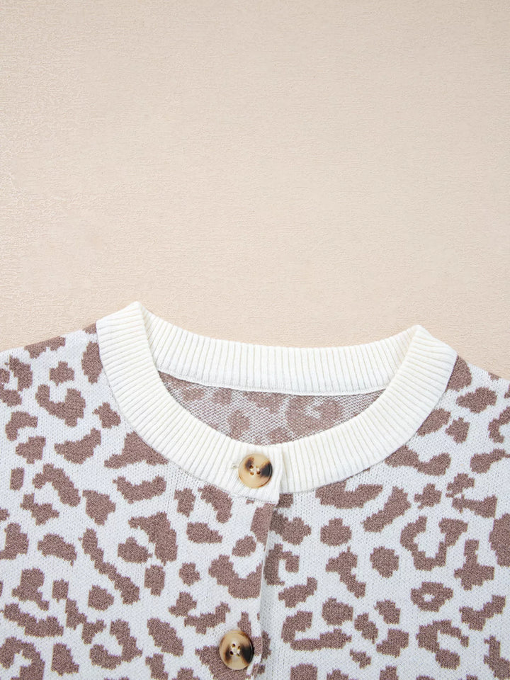 Detail of the buttons and ribbed neckline on the ivory leopard cardigan