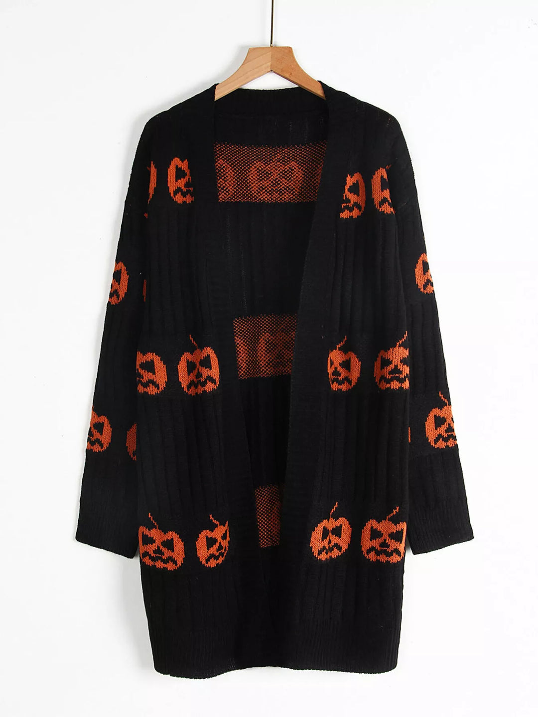 Black open front pumpkin cardigan on a hanger showing the front opening