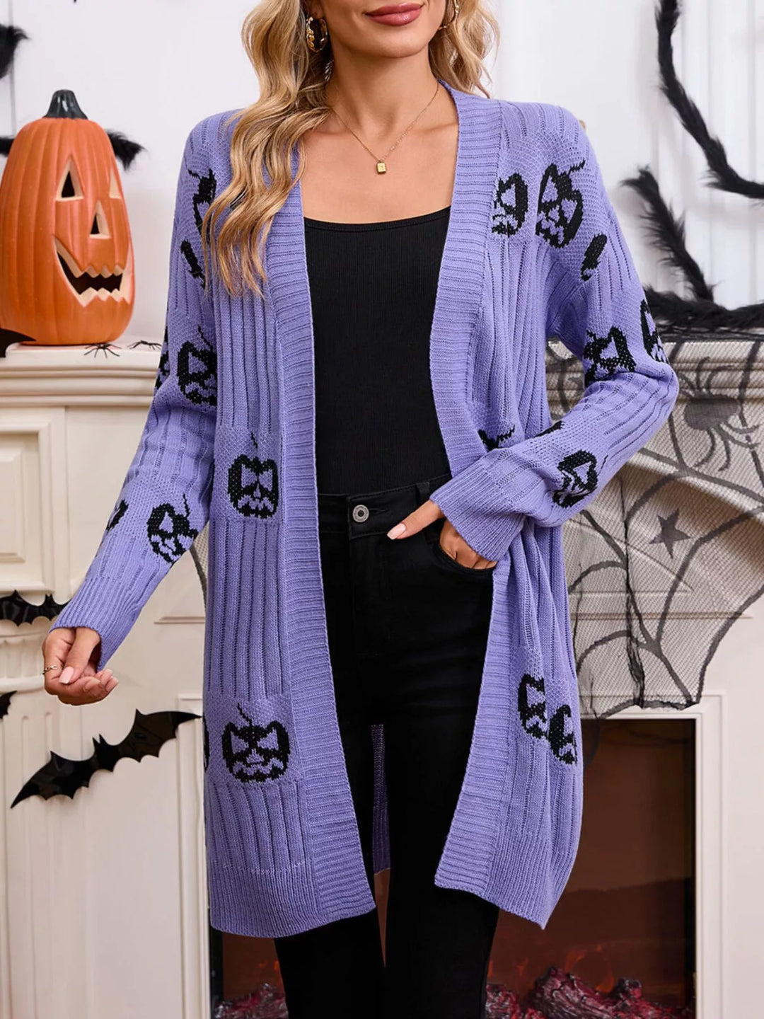 Lavender open front pumpkin cardigan with hand in pocket, Halloween backdrop