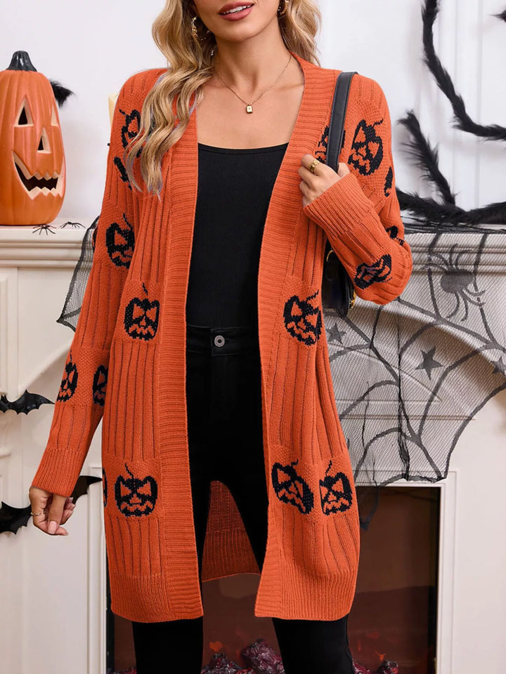 Orange long cardigan with black pumpkin pattern, open front and ribbed knit