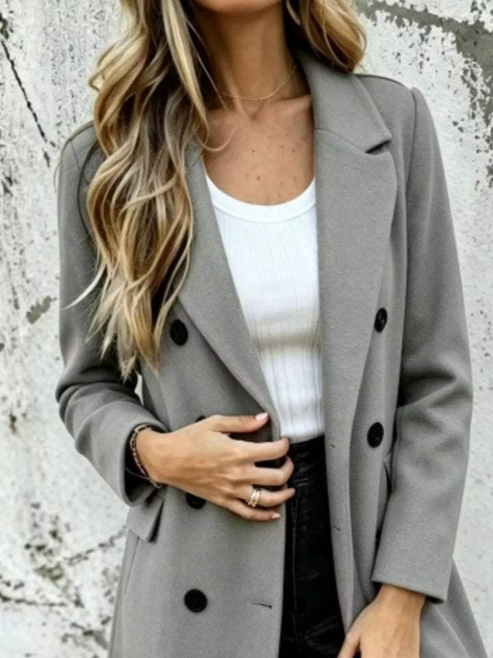 Gray long coat close-up of the notched lapel and button front