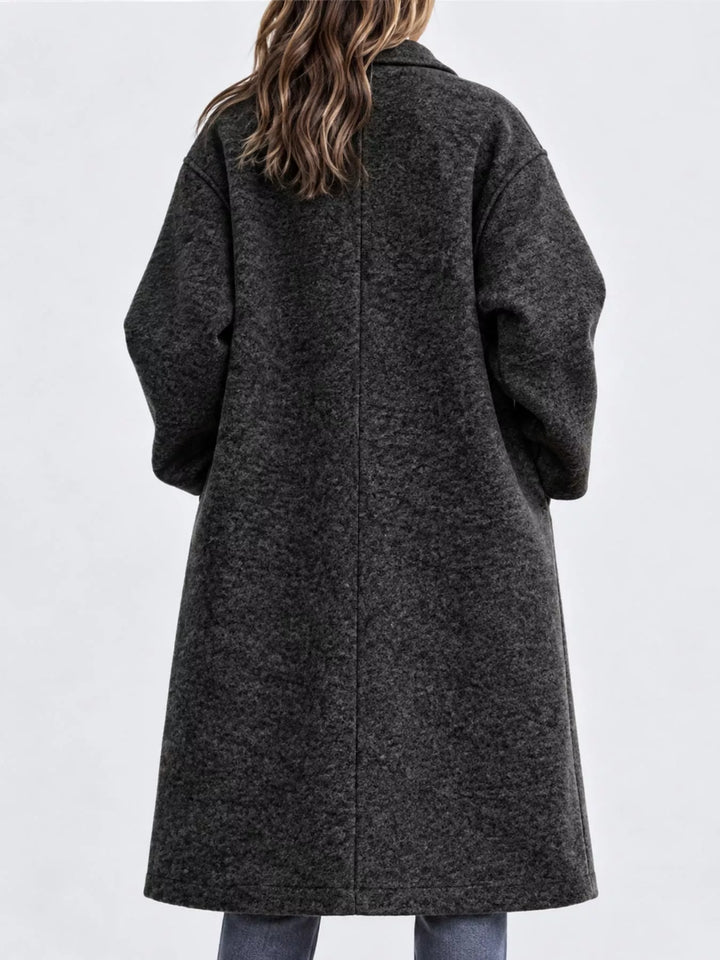 Oversized lapel one button longline in black, back view