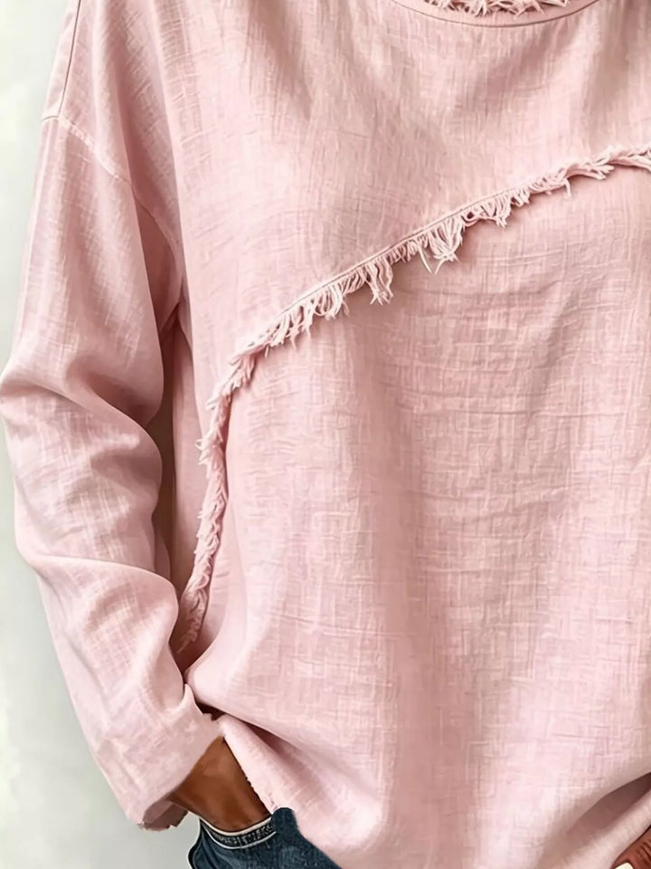 Frayed diagonal seam round neck in blush pink, close-up detail 2