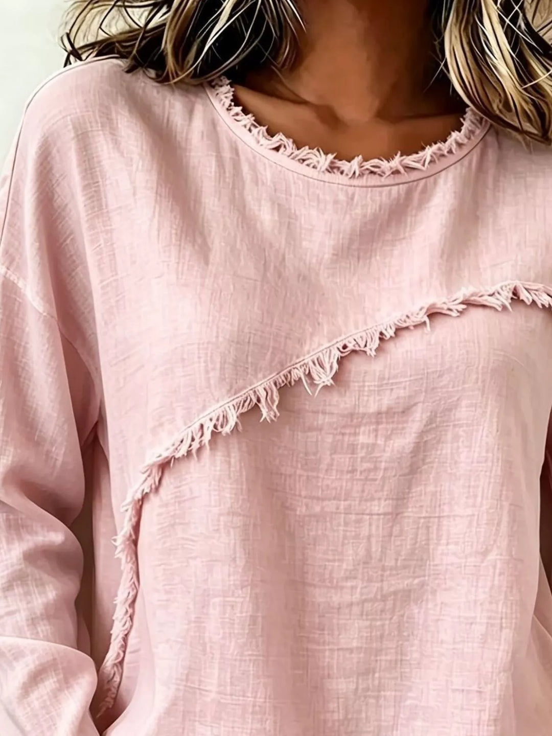 Frayed diagonal seam round neck in blush pink, close-up detail