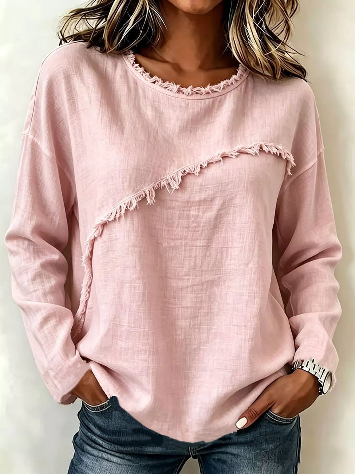 Women's long sleeve blouse in blush pink, frayed diagonal seam round neck