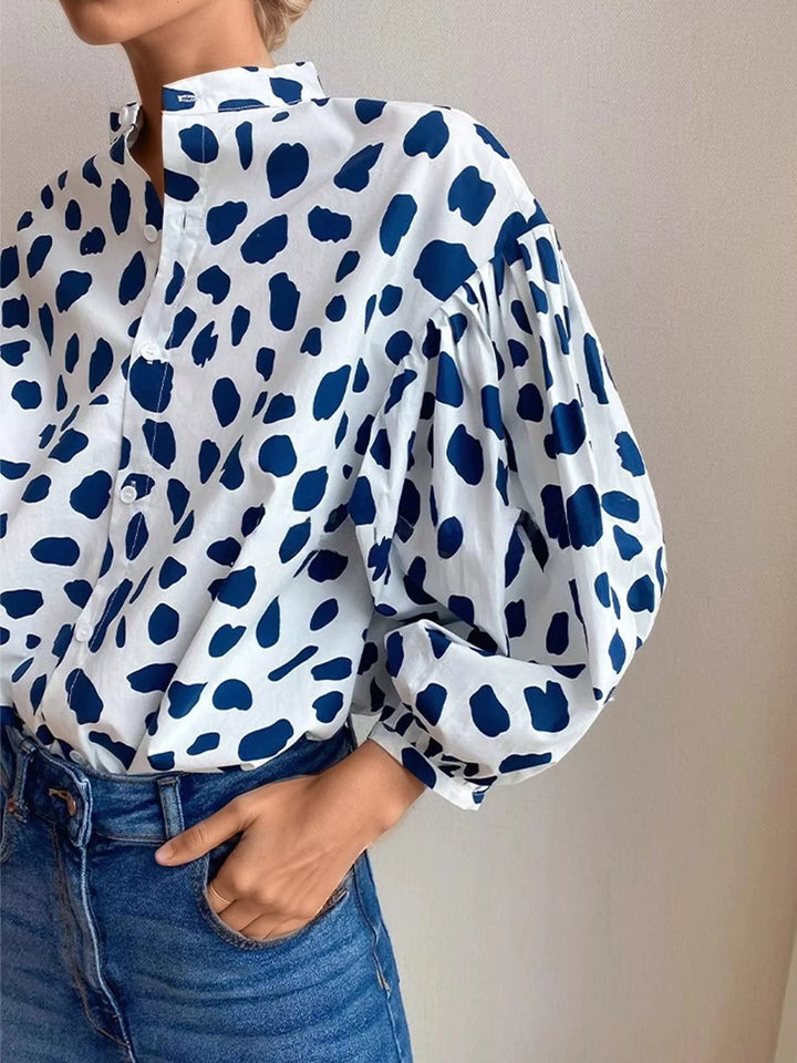 Spot print split collar button front in blue, close-up detail
