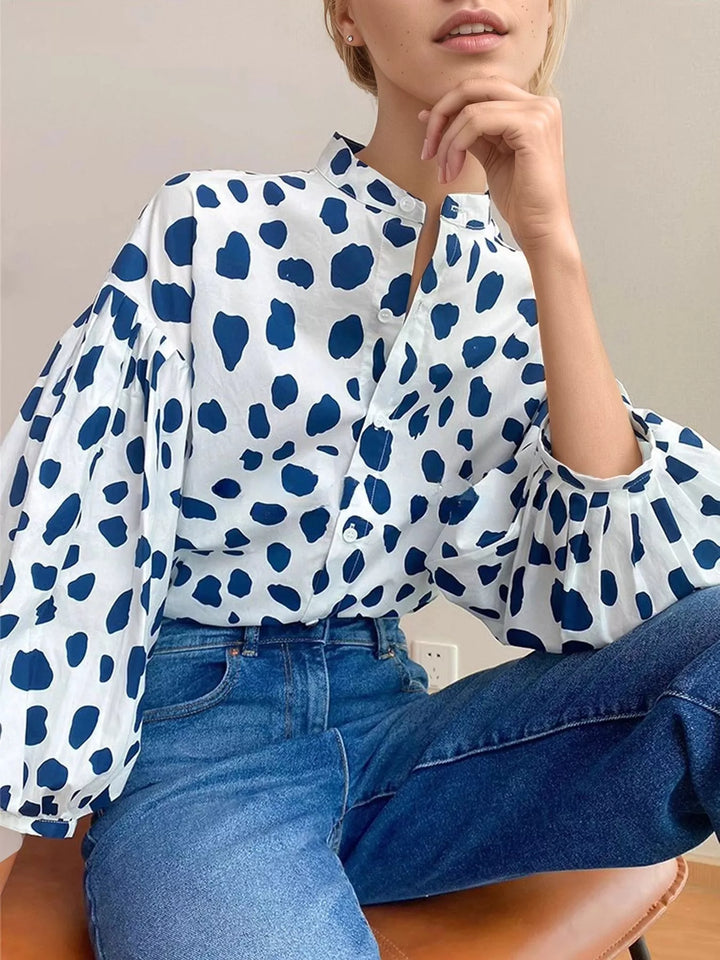 Spot print split collar button front in blue, styled on model 2