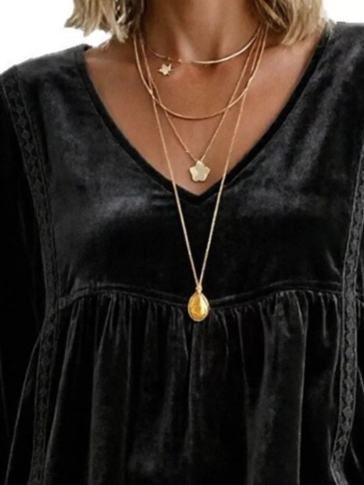 Velvet-look babydoll v-neck lace trim in black, close-up detail