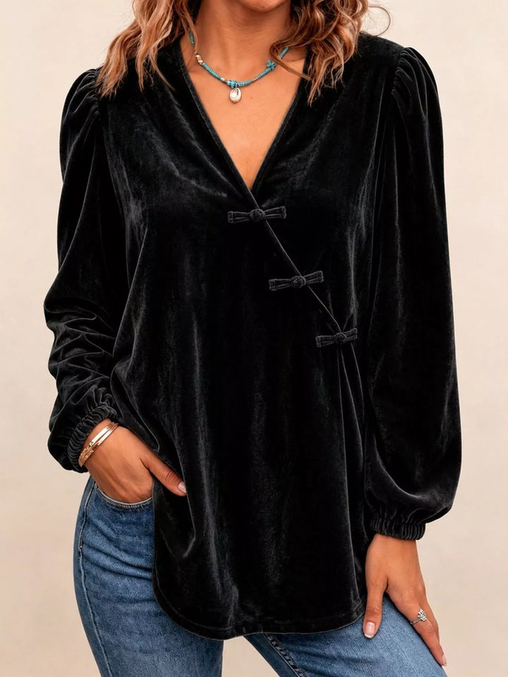 Velvet-look knot button puff sleeve in black, front view