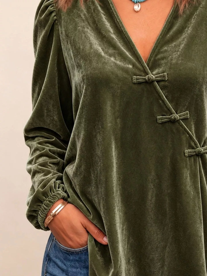 Velvet-look knot button puff sleeve in dark green, styled on model