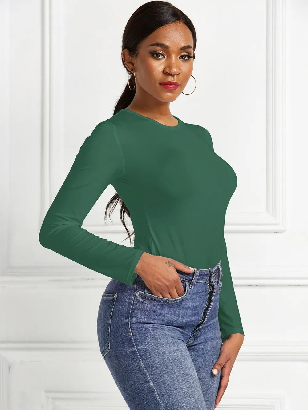 Crew neck high cut snug stretch in dark green, styled on model 3