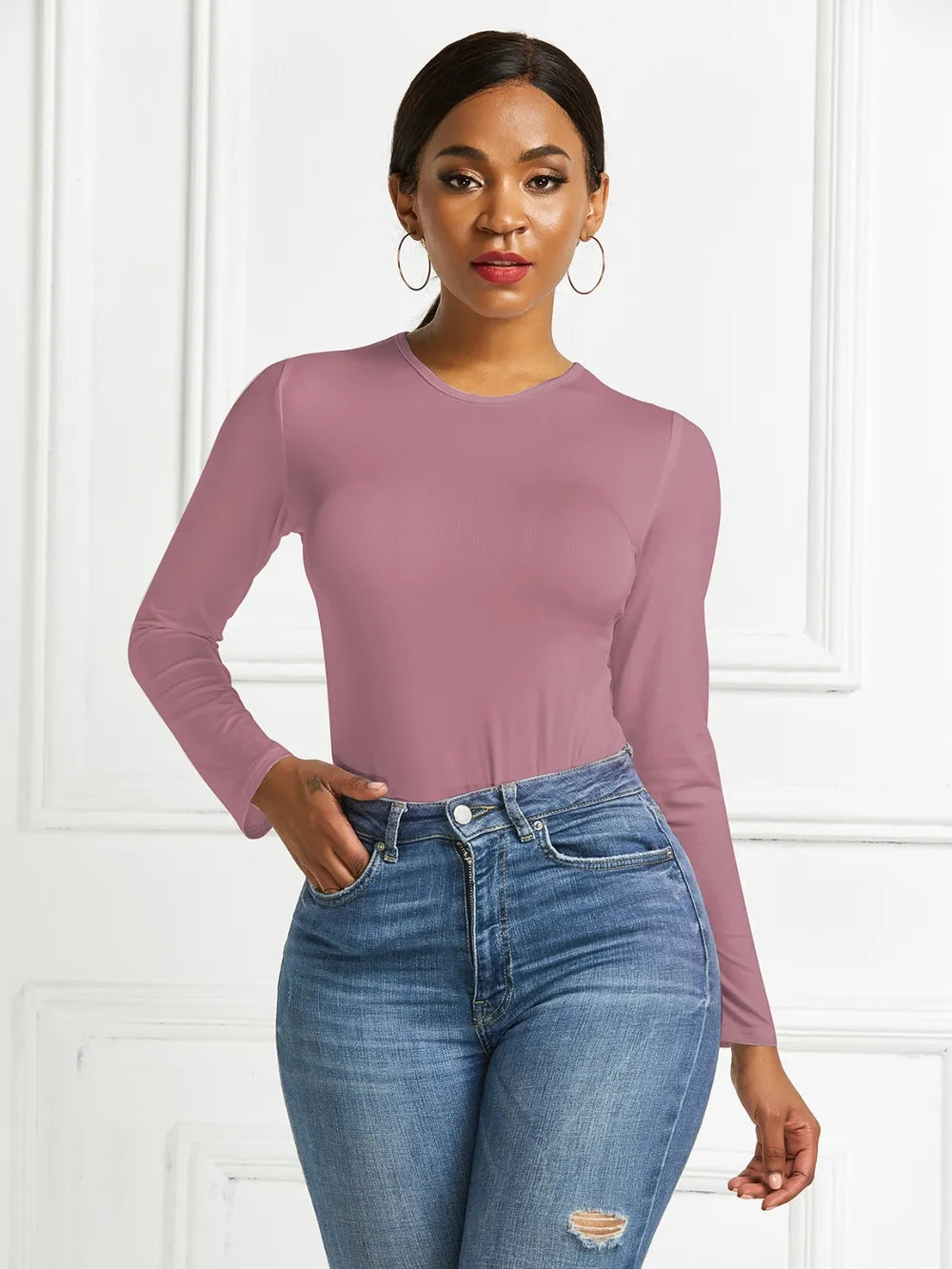 Crew neck high cut snug stretch in dusty pink, styled on model 2