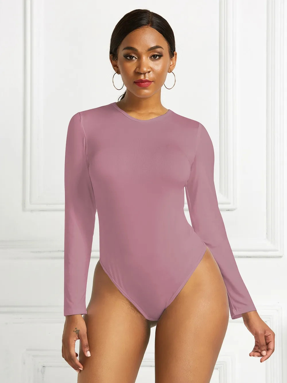 Crew neck high cut snug stretch in dusty pink, styled on model