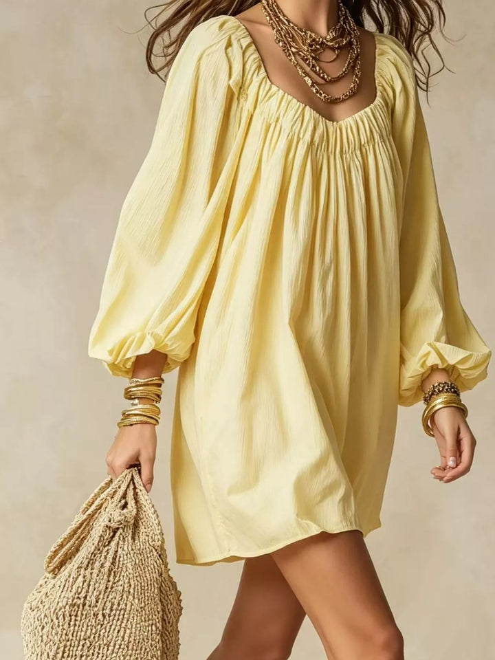 Balloon cuff gathered neckline mini in yellow, styled on model 2