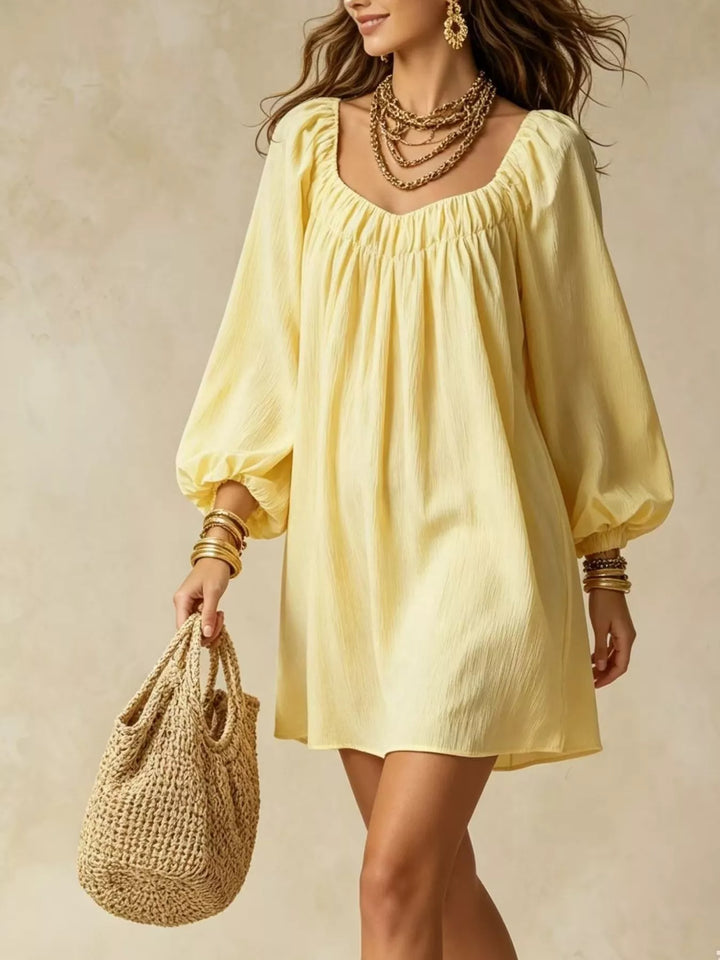 Balloon cuff gathered neckline mini in yellow, styled on model