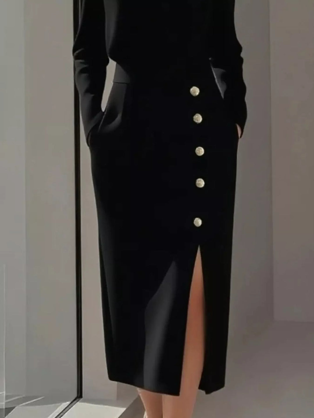 Round neck side button slit pockets in black, close-up detail 2