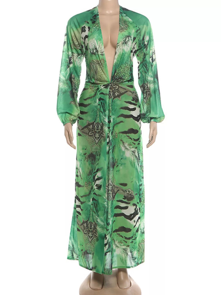 Green maxi dress shown flat with deep V-neck