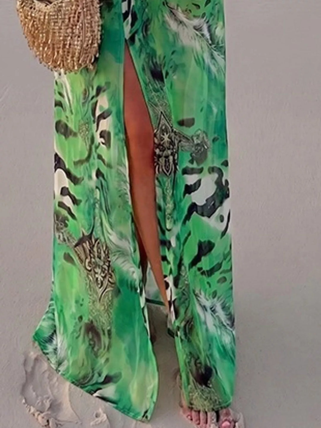 Green maxi dress worn on a model, showing the long sleeves