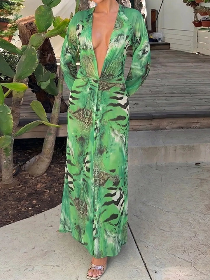 Green maxi dress worn on a model, showing the deep V-neck