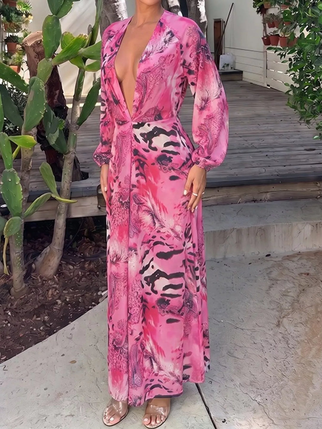 Pink maxi dress worn on a model, showing the bold print
