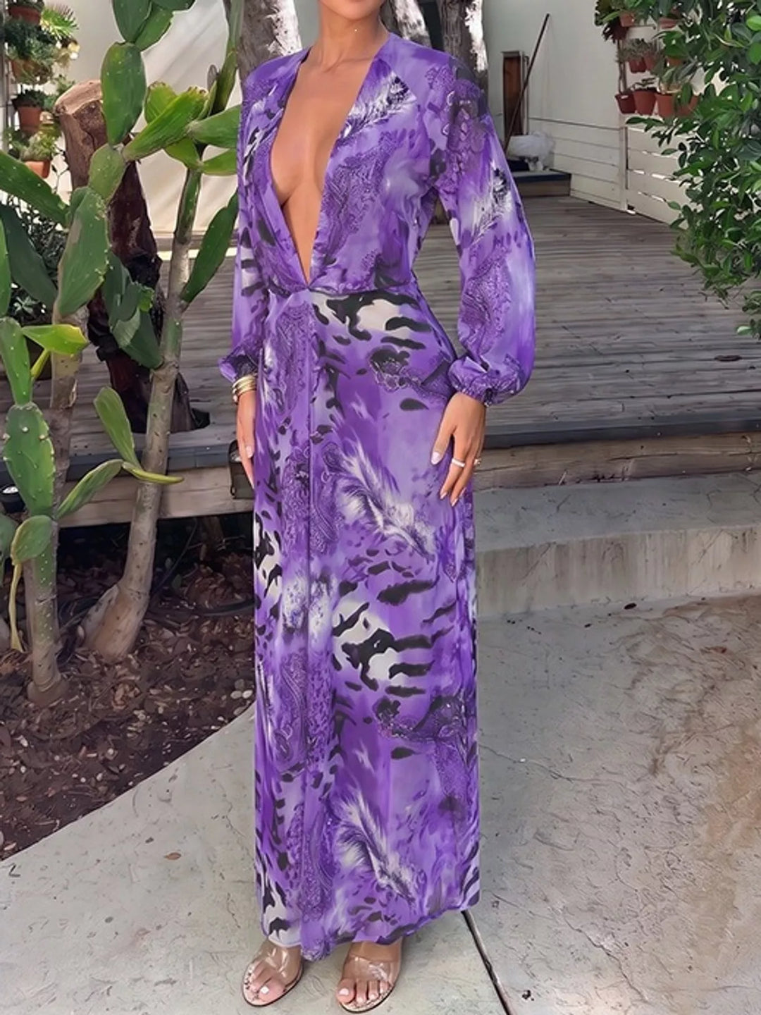 Purple maxi dress worn on a model, showing the deep V-neck