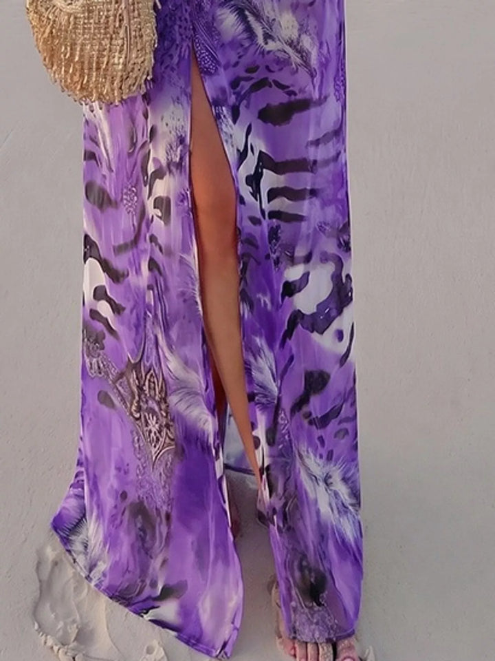 Purple maxi dress worn on a model, showing the leg slit